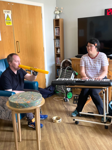 Resident enjoying music therapy