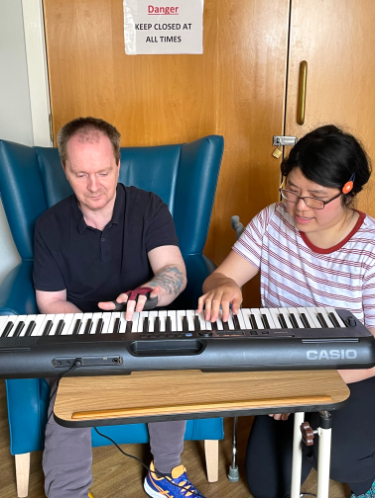 Resident enjoying music therapy