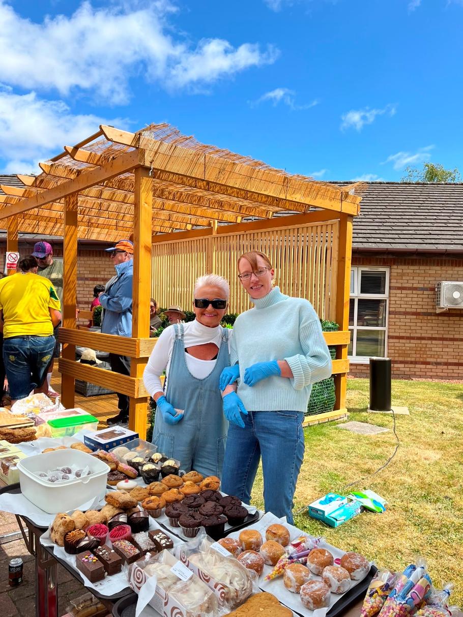 guests at summer fete cake stand