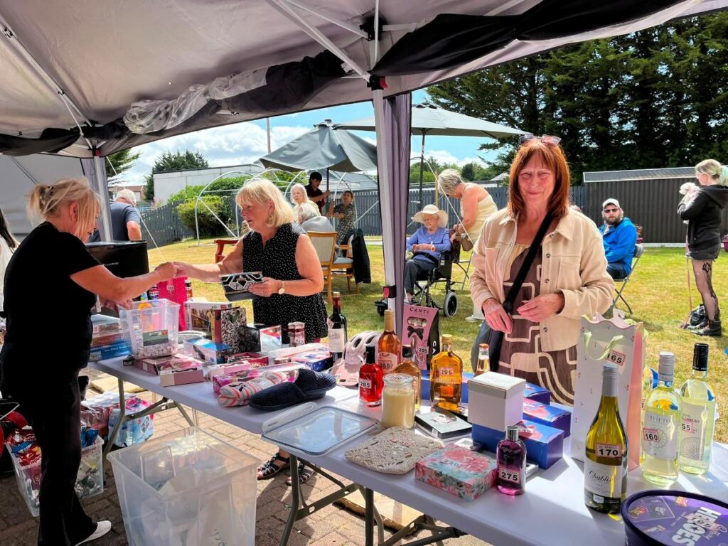 guests at summer fete stall